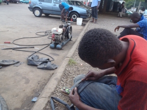 A "Vulcanizer" with his source of survival in the background